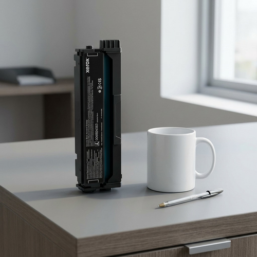 A visual scale comparison showing the Xerox Black Print Cartridge next to a standard ceramic coffee mug on a desk.